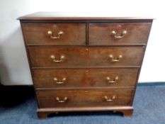 A George III mahogany chest of two over three drawers with brass drop handles,