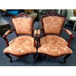 A pair of reproduction French style salon armchairs