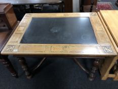A 19th century oak and beech marquetry inlaid library table with a marble inset panel,