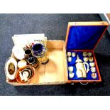 A box containing cased onyx eastern coffee set (as found), Japanese vase, framed needlework panels,