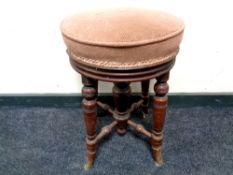A circular Victorian mahogany adjustable stool