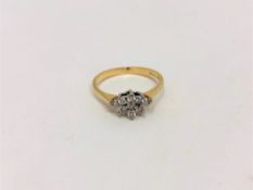 An 18ct gold diamond cluster ring, size K CONDITION REPORT: 2.