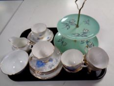 A tray containing a Royal Winton bone china cake stand together with nineteen pieces of Dorchester