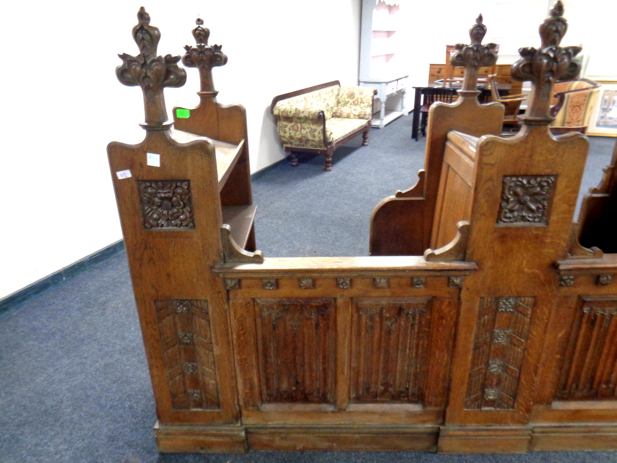 A 19th century heavily carved oak twin-section prayer stall, - Image 5 of 6