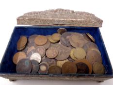 A metal embossed trinket box containing a quantity of Victorian and Edwardian copper coinage