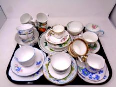 A tray containing an assortment of tea cups and saucers including Roslyn, Royal Albert, Paragon,
