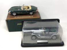 A Burago Jaguar E Cabriolet 1961 die cast car mounted on a plinth, boxed,