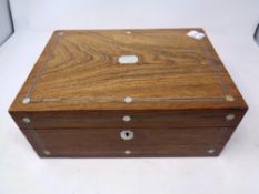 A 19th century mother of pearl inlaid rosewood sewing box