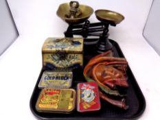 A tray containing a set of Librasco kitchen scales with weights, vintage tins by Jacobs,