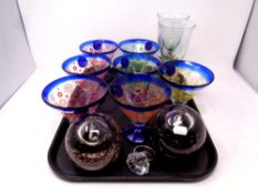 A tray containing a set of six blue glass sundae dishes, pair of glass diffusers,