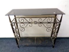 A wrought iron glass topped hall table,