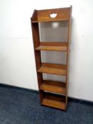 A set of Edwardian oak narrow bookshelves,