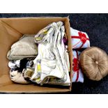 A box containing a large quantity of assorted cushions and cushion covers