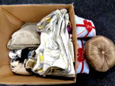 A box containing a large quantity of assorted cushions and cushion covers