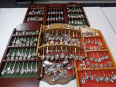 A large quantity of collector's spoons on seven wall racks to include commemorative,