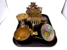 A tray containing ornate brass desk standish, brass hourglass enamelled swing handled dish,