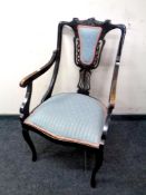 A 19th century ebonised armchair