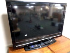 A Sharp 32'' LCD TV with universal remote together with a Roku box with remote