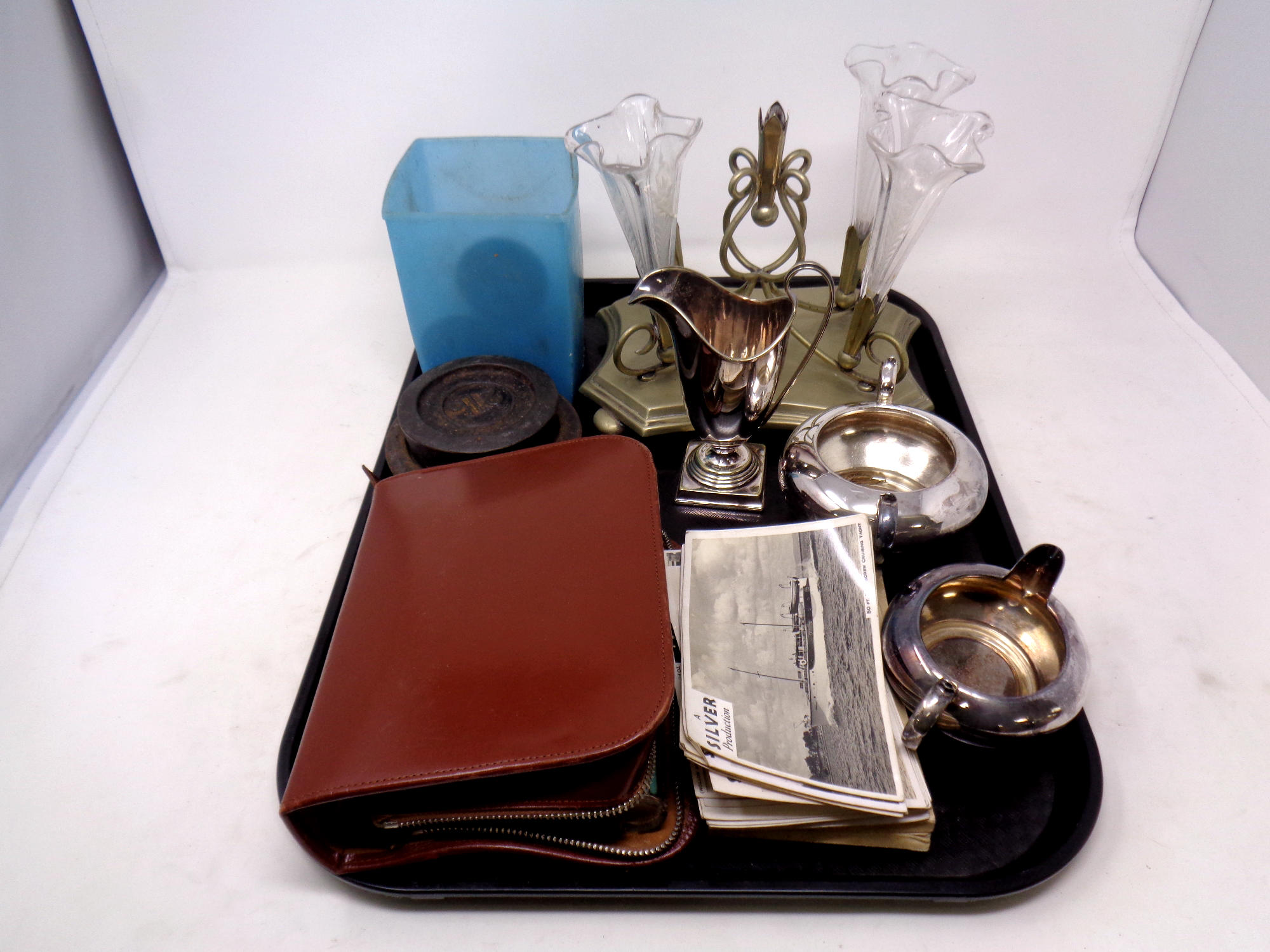A tray containing assorted plated wares, plated with three glass flutes, cased travel set,