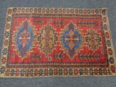 A Balouchi rug 122cm by 82cm