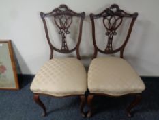 A pair of 19th century mahogany drawing room chairs on cabriole legs