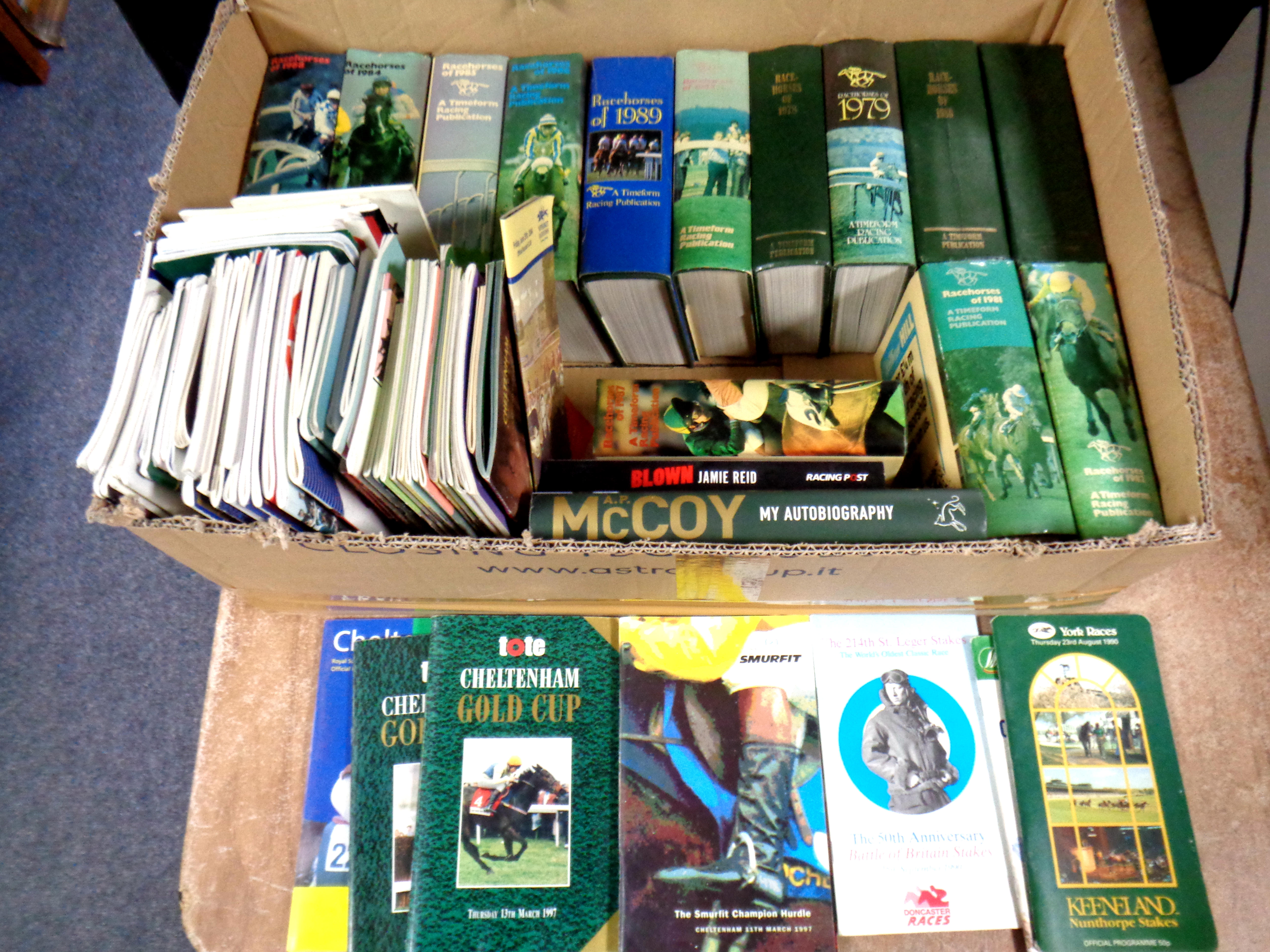 A box containing twelve 1970s/1980s horse racing almanacks together with two further