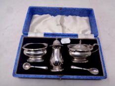 A five piece Walker and Hall silver plated cruet set in box