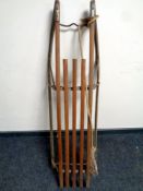 A 20th century wood and iron sledge