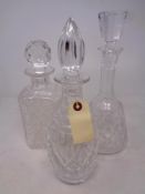 Three cut glass lead crystal decanters with stoppers