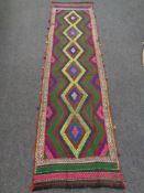 A Suzni kilim runner 280cm by 67cm