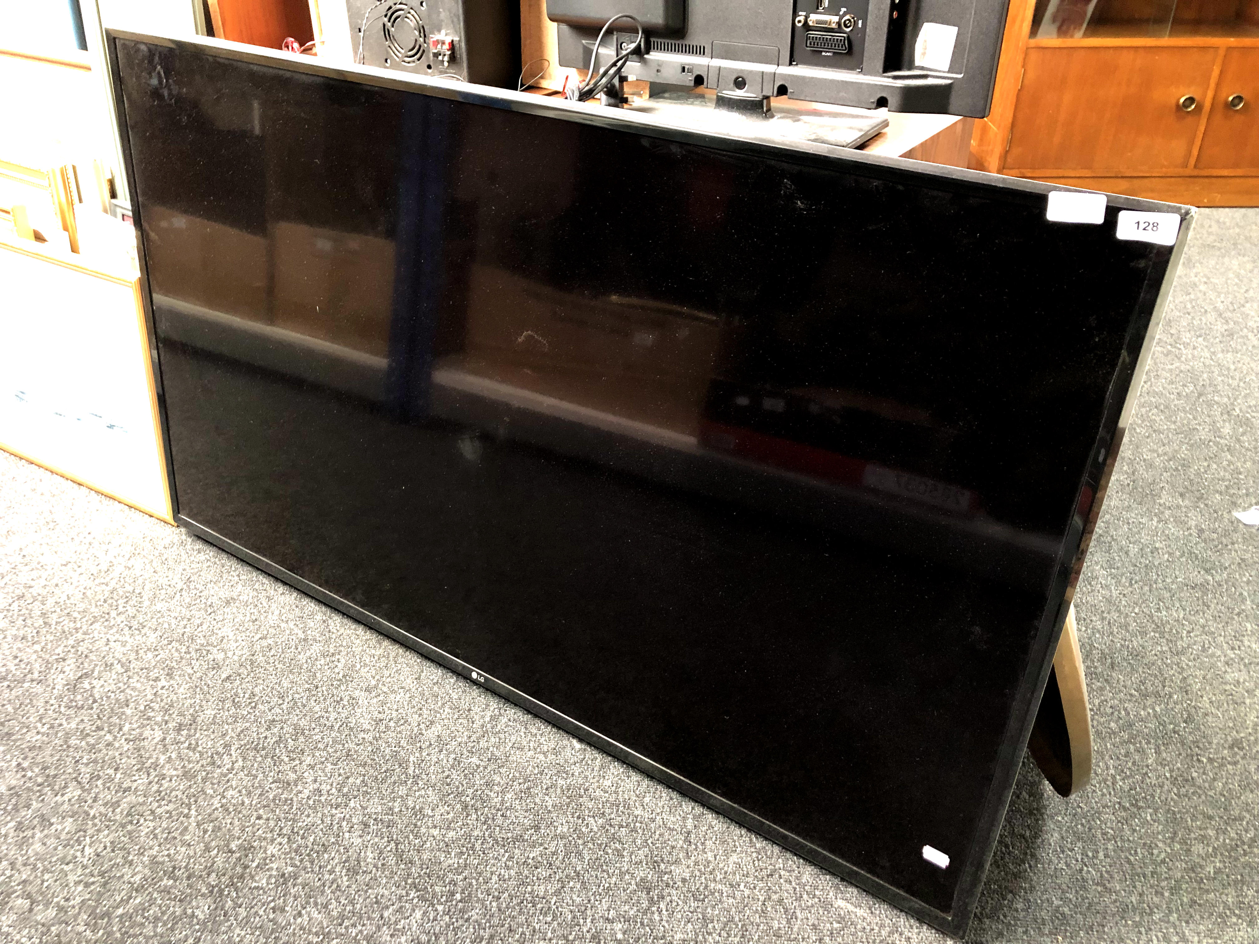 An LG 55'' LCD TV with universal remote