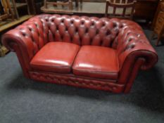 A Chesterfield button leather two seater settee