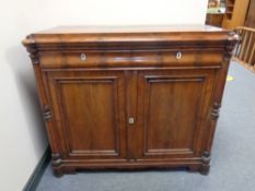 A 19th century mahogany double door sideboard fitted two drawers above,