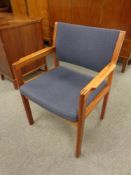 A mid 20th century Danish teak armchair upholstered in a blue fabric