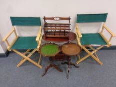 Two folding director's chairs together with a magazine table,