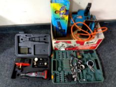 A box containing power tools to include Black and Decker hand saw, a Dremel multi tool,