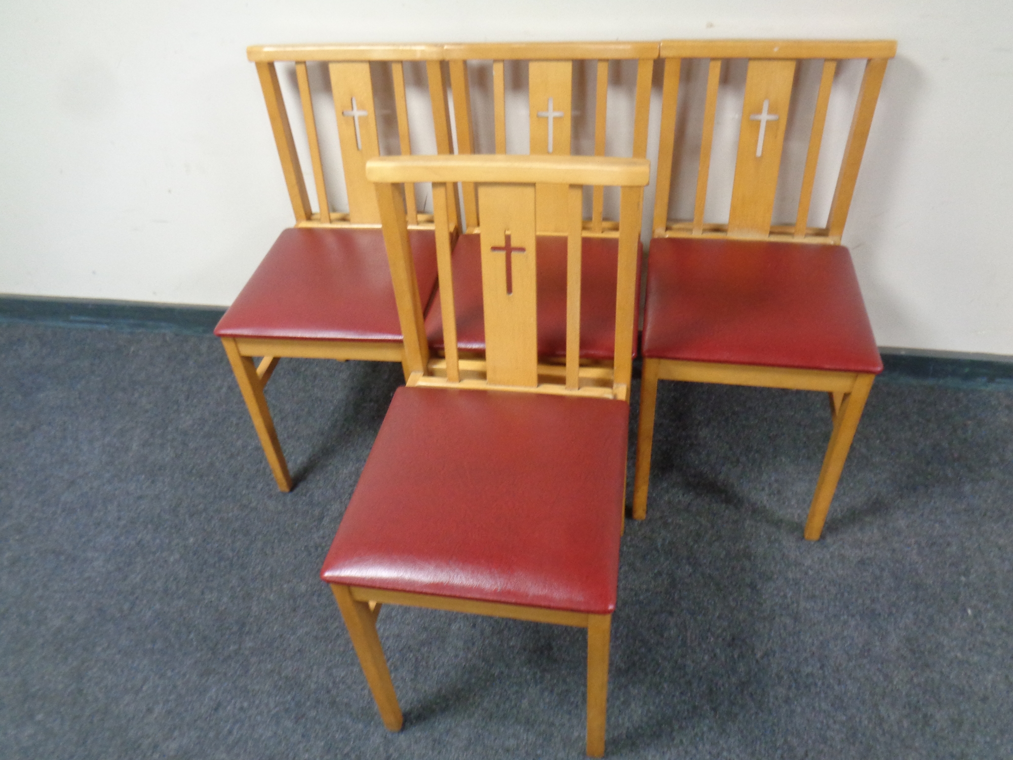 A set of four 20th century chapel chairs