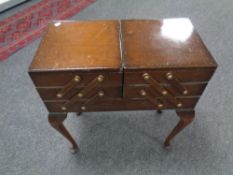 A 20th century concertina sewing box on cabriole legs