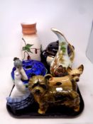 A tray containing assorted ceramics to include Cooper Craft dog ornaments, Nao figure,