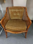 A bamboo and bergere armchair
