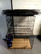 Three folding metal dog cages