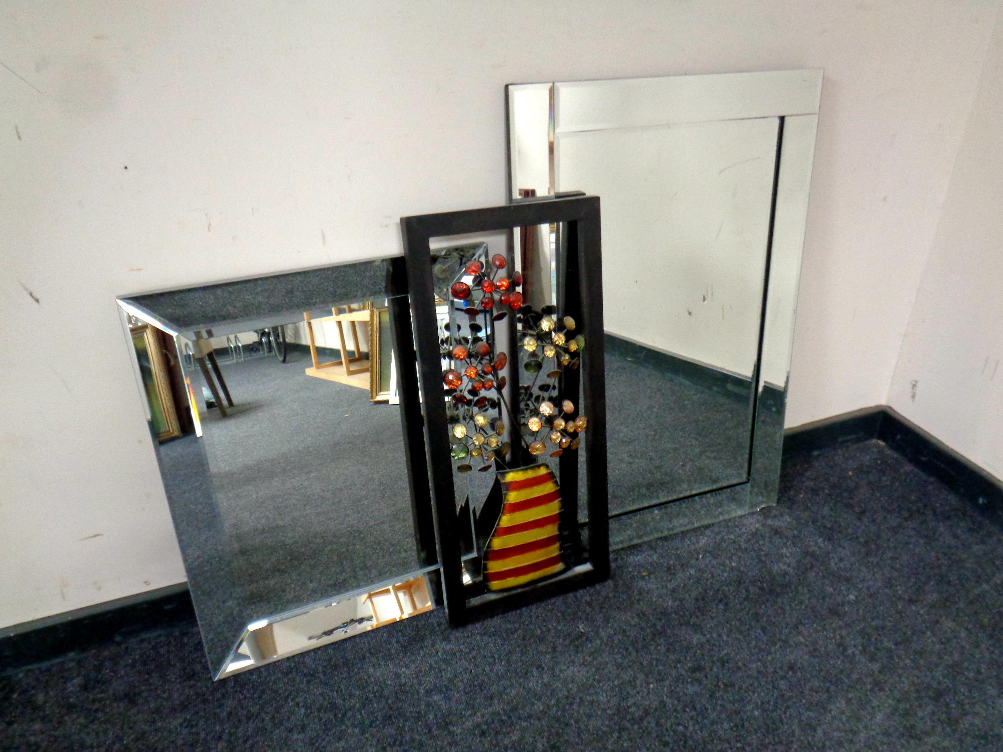Two all glass mirrors (one as found) and a piece of metal wall art