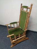 A 20th century American rocking chair upholstered in a green fabric