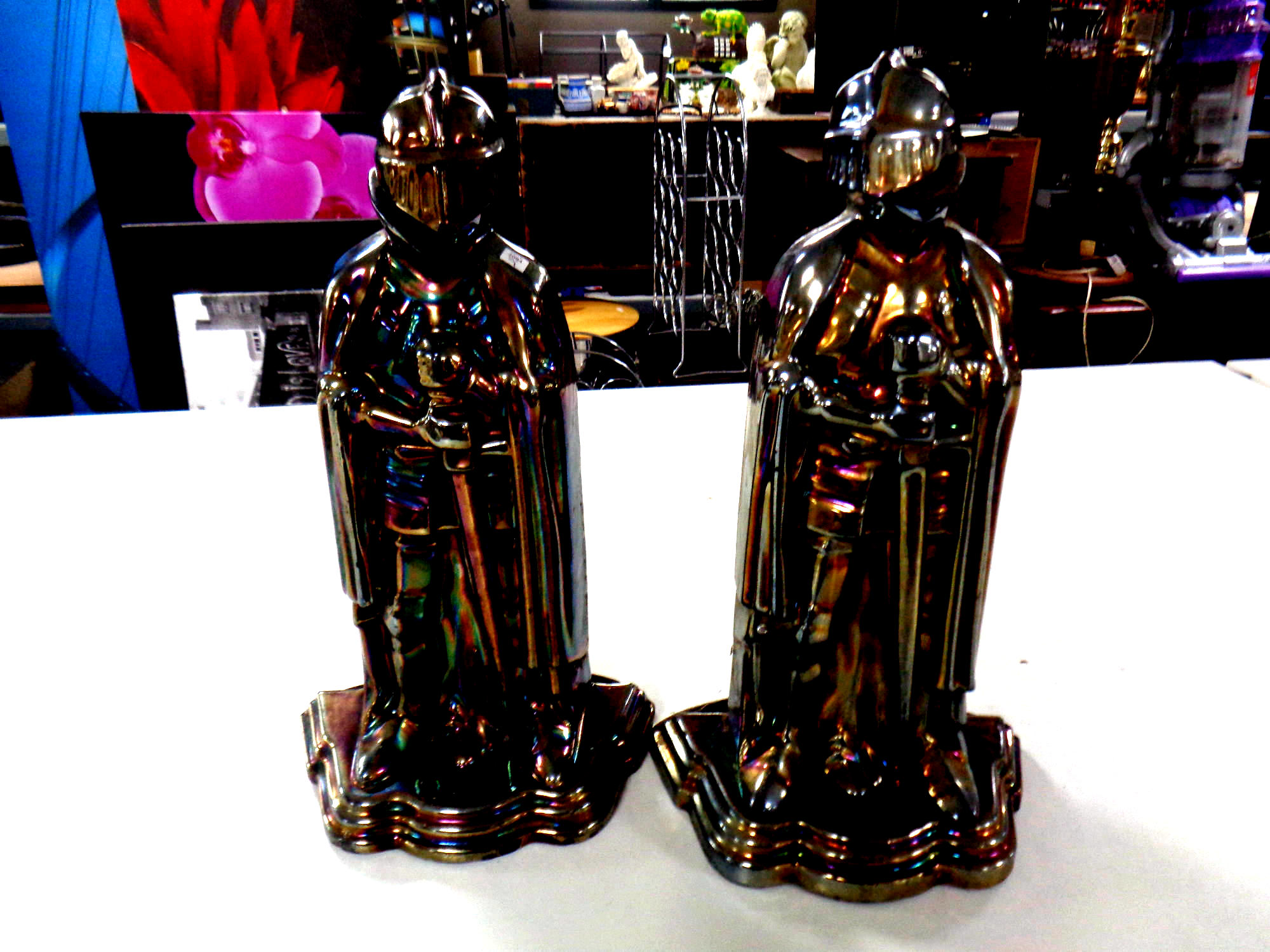 Two lustre cast iron Knight companion stands