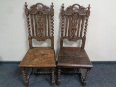 A pair of carved oak barley twist hall chairs