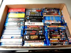 A box containing a large quantity of Blu Ray movies and box sets