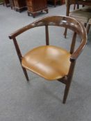 A mid 20th century Danish teak armchair with tan vinyl seat