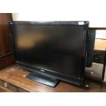 A Toshiba 37'' LCD TV with lead and remote