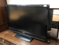 A Toshiba 37'' LCD TV with lead and remote