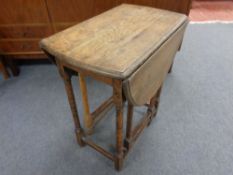 An early 20th century oak gate leg table